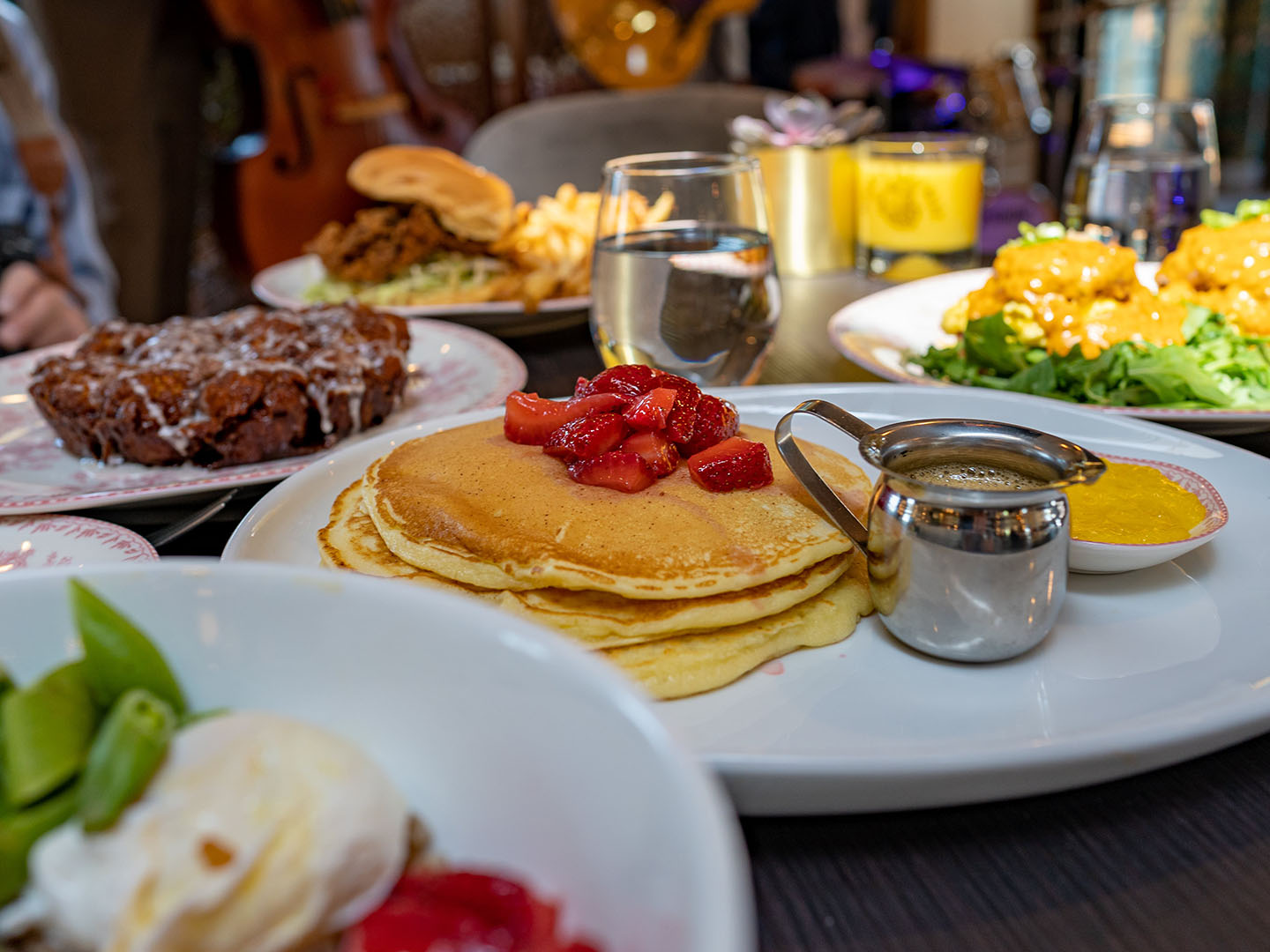 Brunch spread with pancakes and syrup