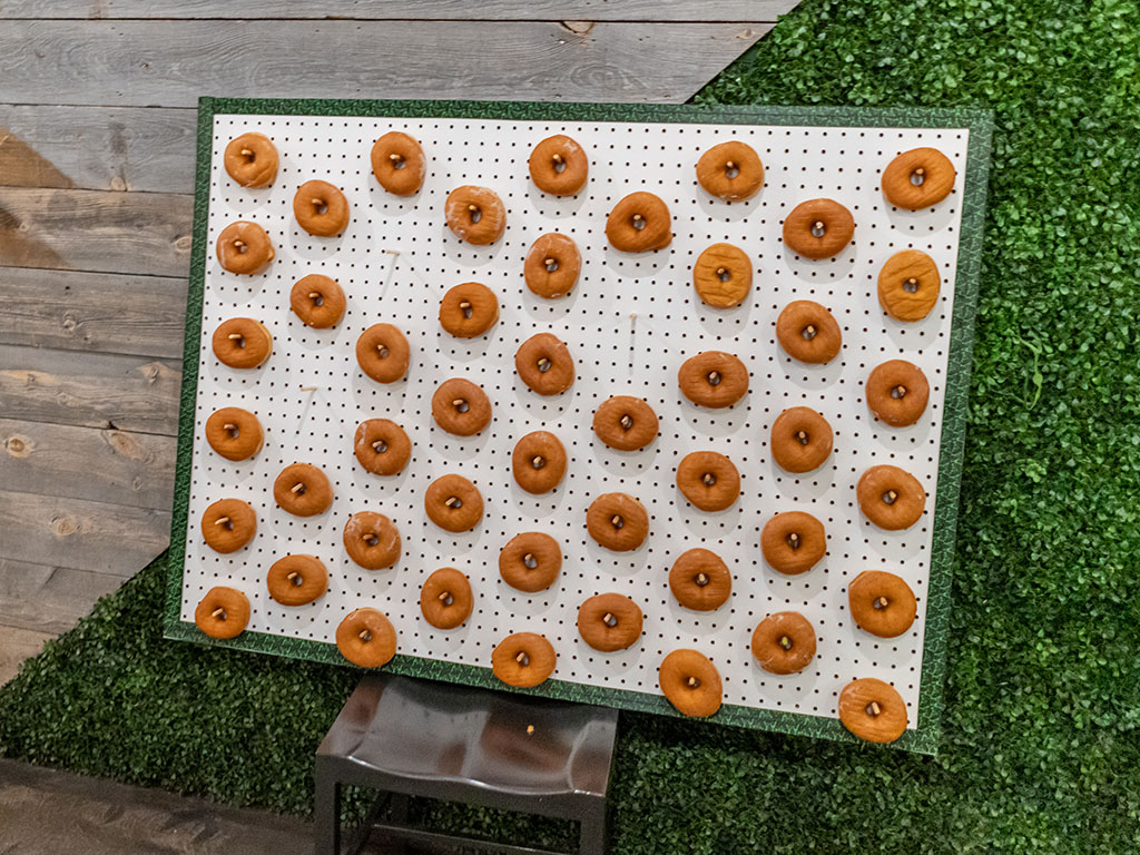 Donuts on a pegboard on a chair